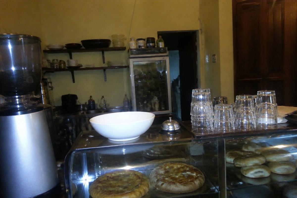 Illustrative example of a dark, cluttered snapshot of a café counter